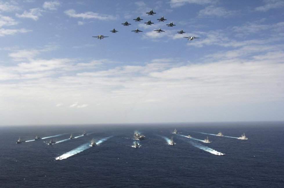 US_Navy_061114-N-8591H-147_Aircraft_assigned_to_Carrier_Air_Wing_Five_CVW-5_fly_over_a_group_of_.jpg