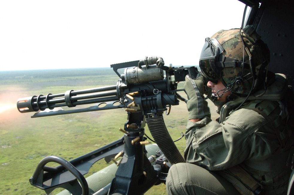 GAU-17_machine_gun_fired_from_UH-1N_Huey_in_2006.jpg