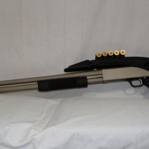 Mossberg 590 with marinecote finish and ATI folding stock