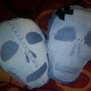 Two skulls pillows from recycled jeans.