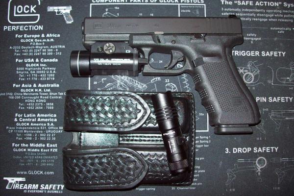 Glock 22 Gen.4 w/Streamlight TLR-1 tac light  /  PT-1L flashlight and Aker 510 double mag pouch.

This is what is on my nightstand.